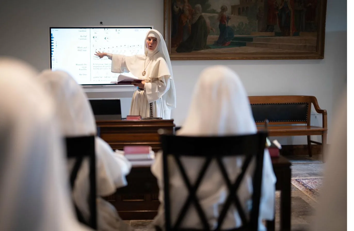 Sister reading in cloister